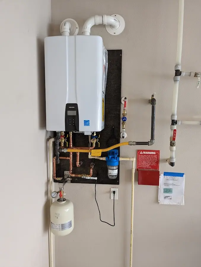 Professional plumber installing copper piping in a Harrodsburg home